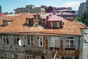 Residential, old areas of Batumi, Georgia. Burgundy roofs of different shapes on a sunny day in Batumi