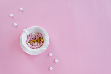 Pills in the dish. Concepts - what we eat, hidden ingredients, addictions.