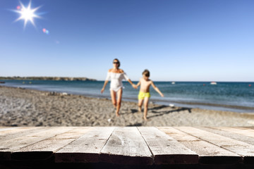 Desk of free space and beach background 