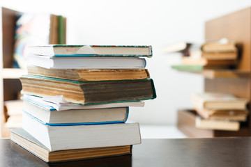 Education concept. Stack of books on table.