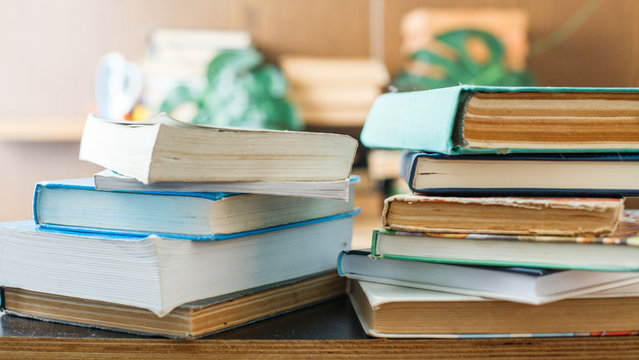 Education concept. Stack of books on table.