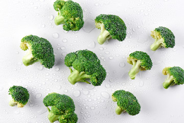 Fresh raw broccoli seamless pattern on a white background, top view. The concept of healthy food,...