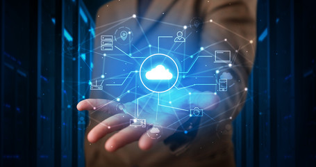 Man holding hologram projection displaying cloud technology symbols