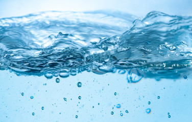 Blue Water and air bubbles over white background