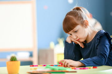 Little girl with autistic disorder in playroom