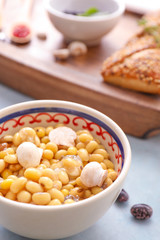 Bowl with boiled beans on table