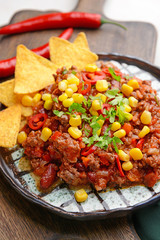 Tasty chili con carne on plate, closeup