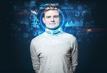 Facial recognition system. Young man on dark background, face recognition concept
