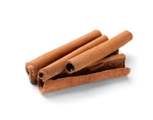 Aromatic cinnamon sticks on white background