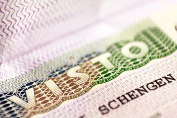 Obraz premium Schengen visa of Italy on the page of the passport, close up