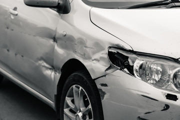 broken car after an accident, black and white photo