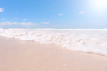 Fototapeta na wymiar Beach, waves, sky and sunshine