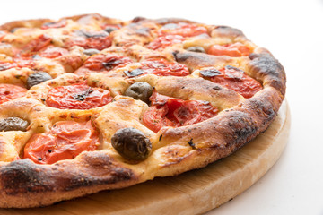 Focaccia typical of Bari Italy with tomatoes and olive