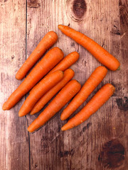 Fresh, organic, raw orange carrots. Food concept with copy space for text.