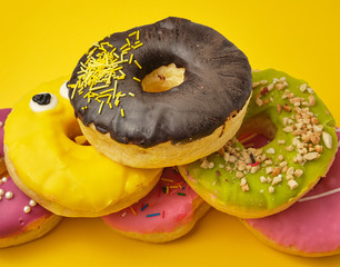 round various sweet donuts with sprinkles