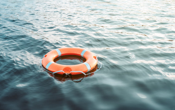 Life buoy floating on the water with copy space