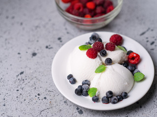 Vanilla ice cream sundae with fresh summer berries