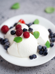 Vanilla ice cream sundae with fresh summer berries