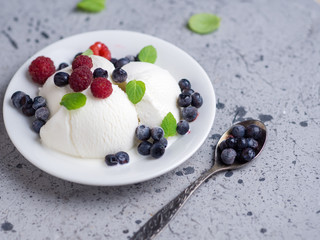 Vanilla ice cream sundae with fresh summer berries