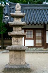 Garden of a house with an asian pagoda statue