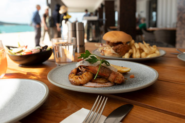 Barbecue King Prawns and other lunch meals on a resort setting