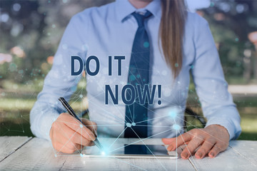 Conceptual hand writing showing Do It Now. Concept meaning not hesitate and start working or doing...