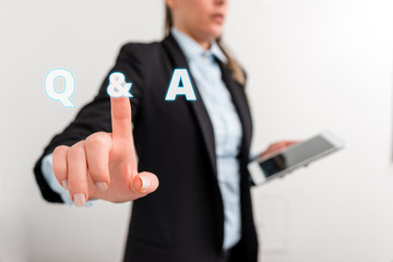 Conceptual hand writing showing Q And A. Concept meaning defined as questions being asked and answers Digital business in black suite concept with business woman