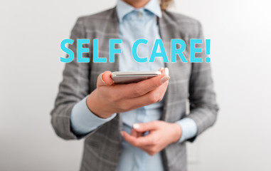 Word writing text Self Care. Business photo showcasing practice of taking action to preserve or improve ones own health Business concept with mobile phone and business woman