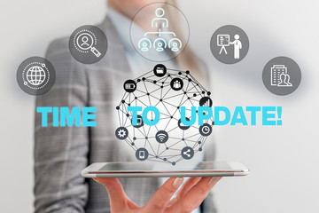 Handwriting text Time To Update. Conceptual photo act updating something someone or updated version program Male human wear formal work suit presenting presentation using smart device