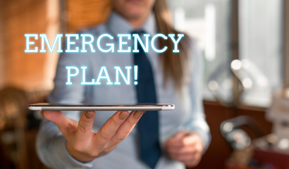 Word writing text Emergency Plan. Business photo showcasing actions developed to mitigate damage of potential events Blurred woman in the background pointing with finger in empty space