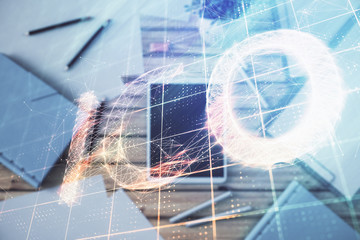 Double exposure of bitcoin drawing on digital tablet on the table background. Concept of blockchain