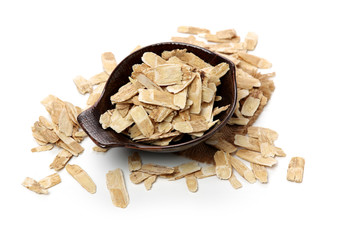 Chinese Herbal medicine - Astragalus slices, Huang Qi (Astragalus propinquus) on white background