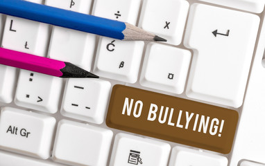 Conceptual hand writing showing No Bullying. Concept meaning stop aggressive behavior among...