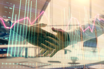 Multi exposure of financial graph on office background with two businessmen handshake. Concept of success in business