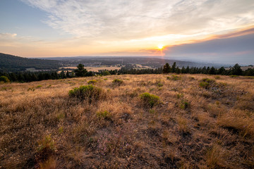 Spokane, WA - 8/6/2019: Smoke from Williams Flat Wildfire rises over downtown Spokane, WA as seen from South Hill