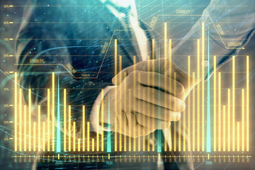 Multi exposure of forex graph on abstract background with two businessmen handshake. Concept of success on stock market