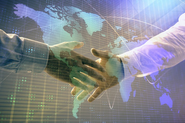 Multi exposure of world map on abstract background with two businessmen handshake. Concept of international business