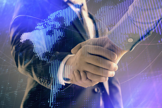 Multi exposure of world map on abstract background with two businessmen handshake. Concept of international business