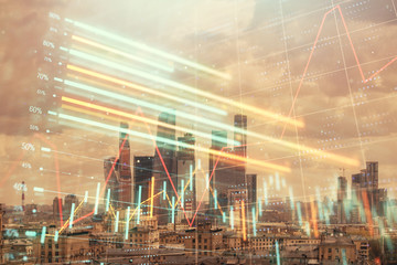 Double exposure of financial graph on downtown veiw background. Concept of stock market research and analysis