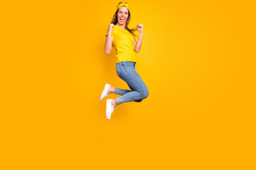 Fototapeta na wymiar Full length photo of beautiful lady jumping high got first place wear casual clothes isolated yellow background