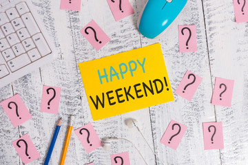 Writing note showing Happy Weekend. Business concept for something nice has happened or they feel satisfied with life Writing tools and scribbled paper on top of the wooden table
