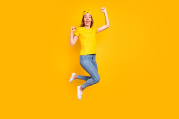 Full size photo of beautiful lady jumping high celebrating first place wear casual clothes isolated yellow background