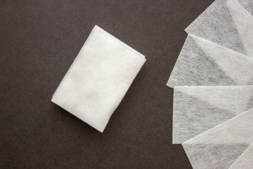 Lint-free wipes on dark background. Professional Nail Care Tools For Manicure. Varnish removal Small nail art and manicure business. Nail Polish and degreasing removal tool.