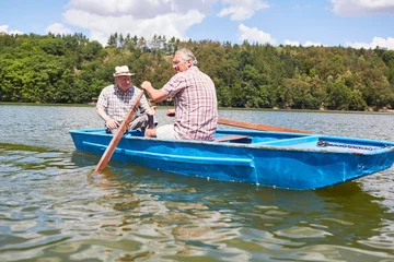 Foto op Canvas Senior man and his father rowing © Robert Kneschke