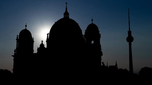 Berlin, July 2014: Berlin Cathedral, Berliner Dom or Evangelical Supreme Parish and Collegiate Church with Alex TV Tower in Background, Time Lapse at Sunset