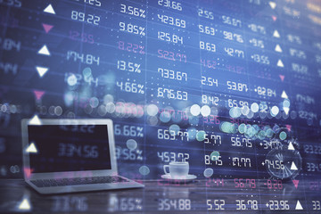 Obraz premium Forex Chart hologram on table with computer background. Double exposure. Concept of financial markets.