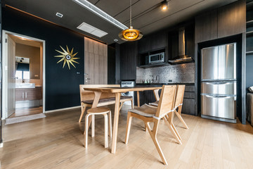 Stylish kitchen interior with dining table and chairs