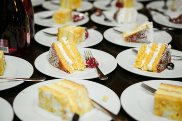 sliced ​​cake in plate saucers