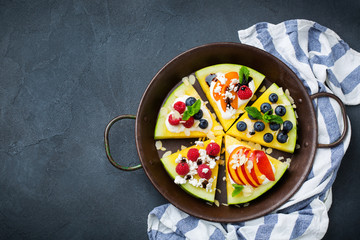 Watermelon pizza with berries, fruits, yogurt, feta cheese