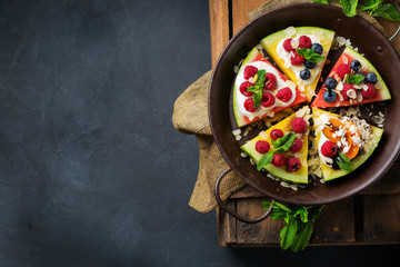 Watermelon pizza with berries, fruits, yogurt, feta cheese